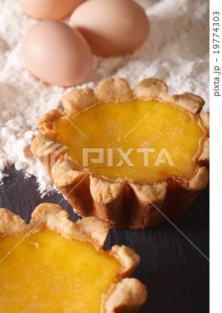 Egg Tart and ingredients on the table macro 19774303
