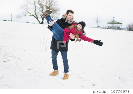 Two teenagers havinf fun on the snow field 19776973