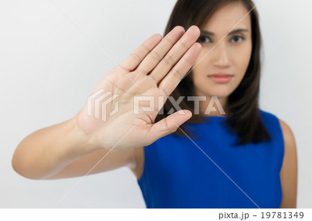 Young woman showing her denial with NO on her hand 19781349