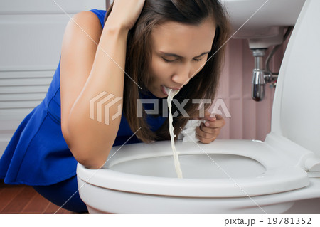 Beautiful adult woman vomiting in toilet 19781352