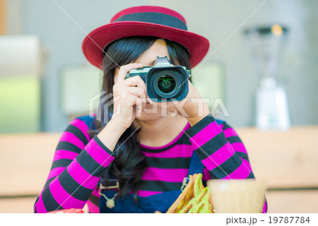 Hipter beautiful young woman with a camera 19787784