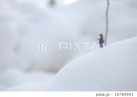 雪と女子高生 ミニチュアの世界の写真素材