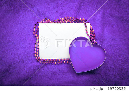 heart with a blank card on violet background 19790326