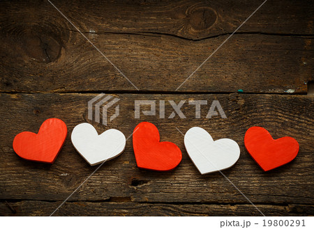 Red and white hearts on old wooden background 19800291