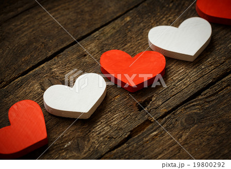 Red and white hearts on old wooden background 19800292