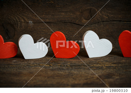 Red and white hearts on old wooden background Red and white hearts on old wooden background 19800310