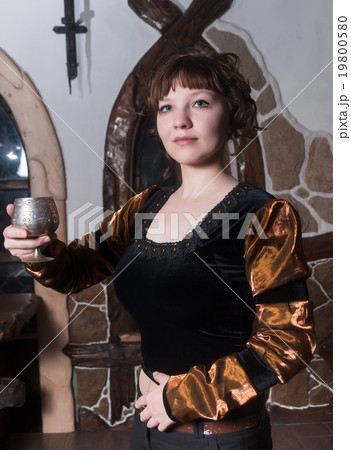 Pretty woman an armchair and with wine glass Pretty woman an armchair and with wine glass 19800580