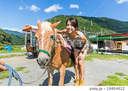 Woman with horse in farm 19804622