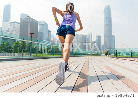 The back view of woman running in Hong Kong 19804971