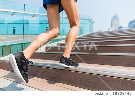 Sporty girl stepping on the staircase 19805449