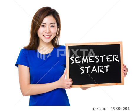 Young woman with blackboard showing semester start Young woman with blackboard showing semester start 19806001