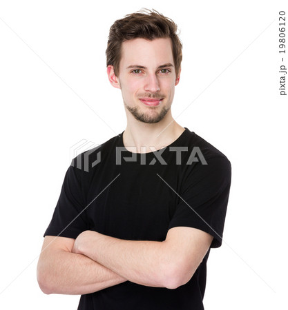 Handsome young man smiling with arms crossed on white background Handsome young man smiling with arms crossed on white background 19806120