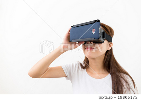 Young woman watching though the VR device 19806175