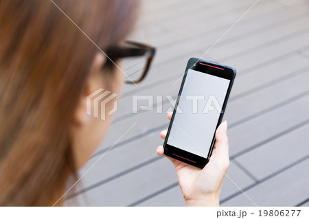 Woman use of the mobile phone with blank screen 19806277