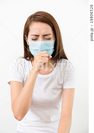 Woman cough though medical face mask 19806526