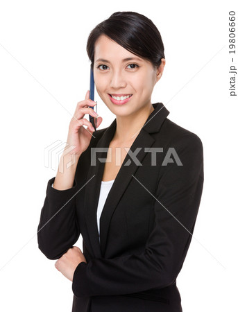 Businesswoman talk to mobile phone Businesswoman talk to mobile phone 19806660
