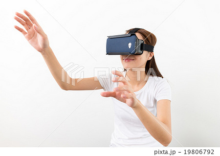 Young Woman experience virtual reality on cellphone Young Woman experience virtual reality on cellphone 19806792
