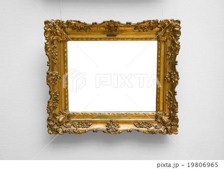 Gold empty frame on white wall 19806965