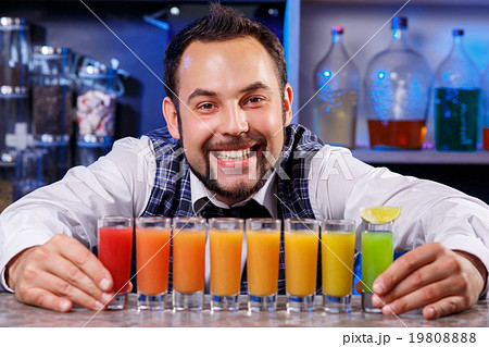 Barman at work, preparing cocktails. Barman at work, preparing cocktails. 19808888