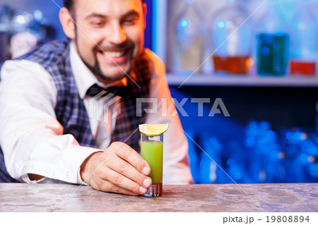 Barman at work, preparing cocktails. Barman at work, preparing cocktails. 19808894