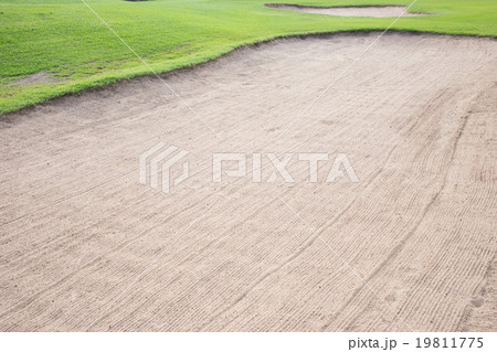 sand bunker and green grass of golf course 19811775