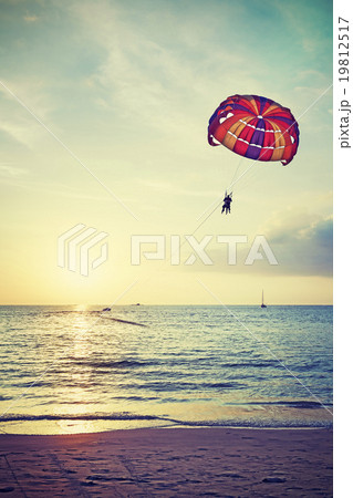 Retro stylized paragliders at sunset. Retro stylized paragliders at sunset. 19812517