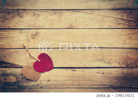 Two red and brown heart on wooden background 19813021