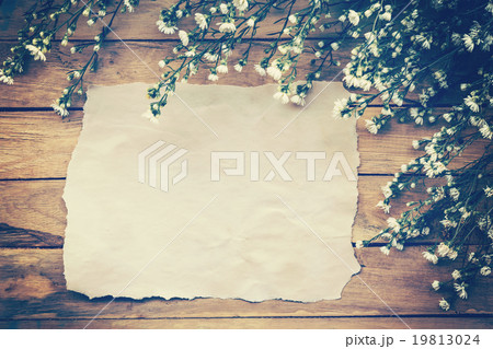 Flowers and old paper on wood texture background Flowers and old paper on wood texture background 19813024