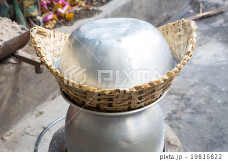 Hot sticky rice in old wooden steamer. Hot sticky rice in old wooden steamer. 19816822