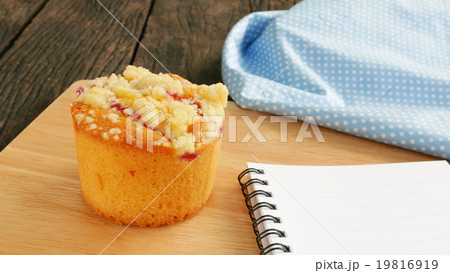 Delicious blueberry muffin on old wooden planks 19816919