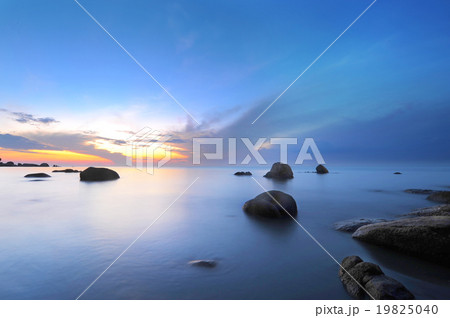 Sunrise at rocky beach. Sunrise at rocky beach. 19825040