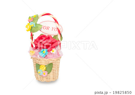 artificial roses in rattan basket on white 19825850