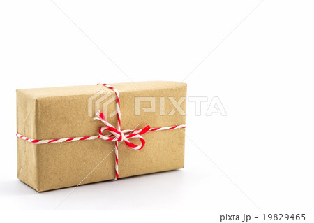 Cardboard carton wrapped with brown paper. 19829465