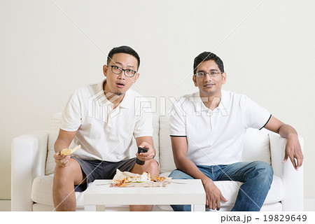 Men friends watching sport match on tv 19829649