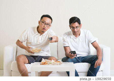 Men friends watching sport game on tv together Men friends watching sport game on tv together 19829650