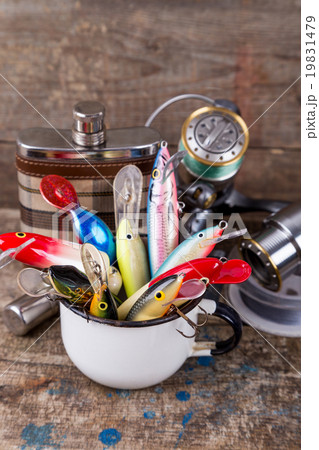 fishing wobblers protrude from white metal cup fishing wobblers protrude from white metal cup 19831479