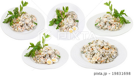 plates with olivier russian salad with mayonnaise 19831698