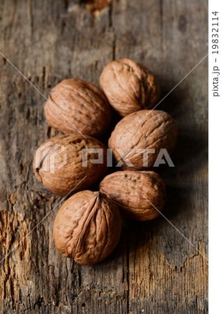 whole walnuts on wooden table 19832114