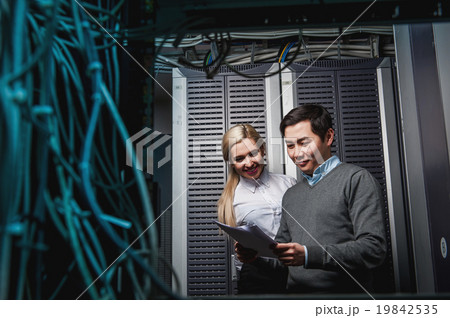 Young engineers businessmen in server room Young engineers businessmen in server room 19842535