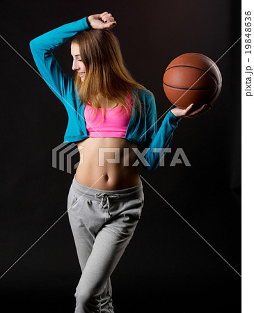 Young girl with basketball ball 19848636