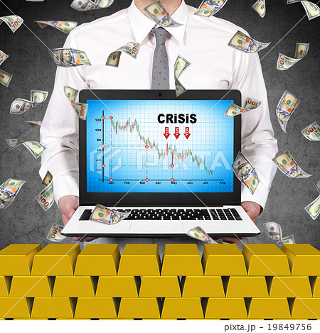 trader holding laptop with crisis chart trader holding laptop with crisis chart 19849756
