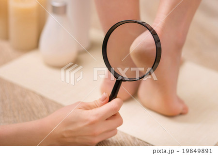Nice woman taking care of her legs  19849891