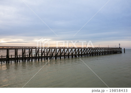 the pier whit light pole at the sea 19858433