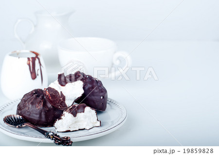 Chocolate  zephyr and cup of coffee  19859828