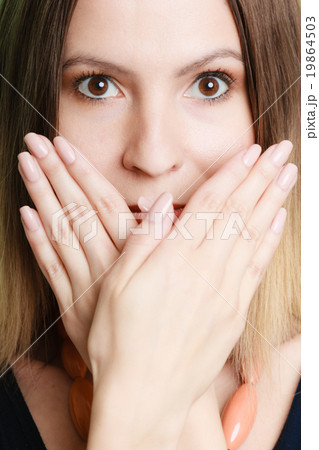 Surprised woman face covering her mouth with hands 19864503