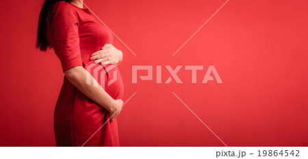Closeup on tummy of pregnant woman Closeup on tummy of pregnant woman 19864542