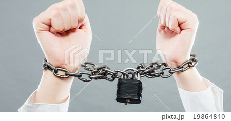 Business woman with chained hands 19864840
