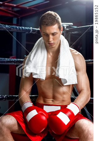 Cheerful boxing champion is having a rest 19865152