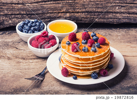 Pancakes with blueberries honey & raspberry Pancakes with blueberries honey & raspberry 19872816