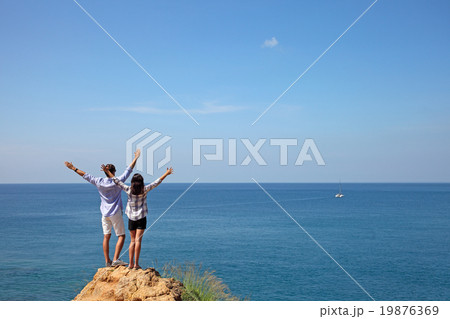 Young couple by the sea Young couple by the sea 19876369
